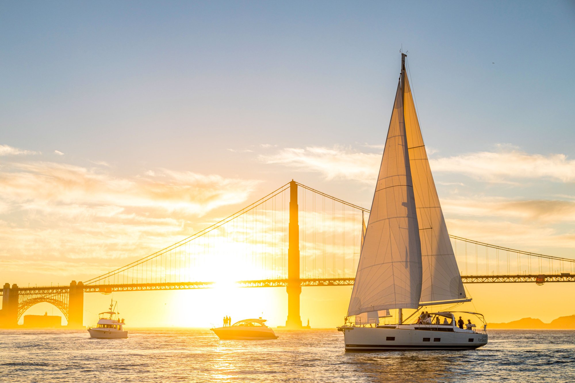 Passage--Nautical-Sunset-Sail-w-powerboat